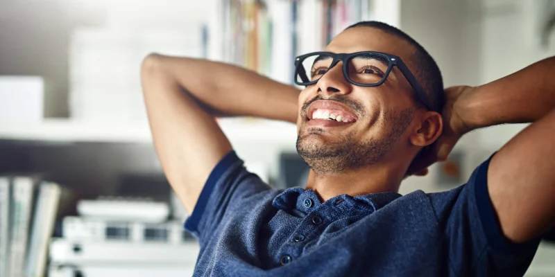 Photo of a man smiling and relaxed after going through a title loan relief program from titleloansonline.com